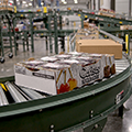 McDougall-RHBrown-cherry-boxes-on-roller-curve-conveyor-thumb